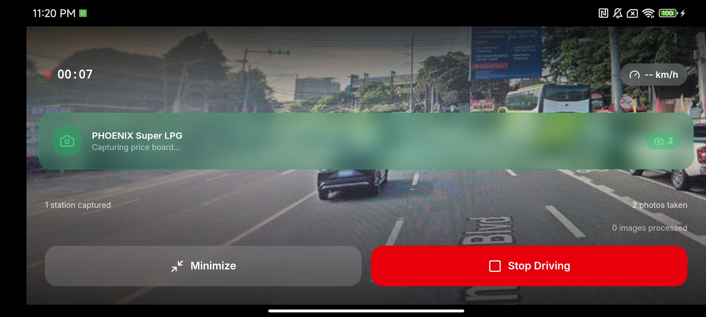 Re-Fuel in driving mode, automatically capturing a price board at a Phoenix station via the rear camera.